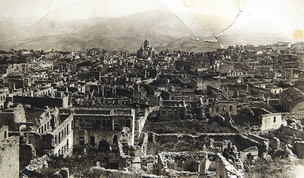 Click image for larger version  Name:	1024px-Armenian_boroughs_of_city_of_Shusha_destroyed_by_Azerbaijani_armed_forces_in_1920_with_defiled_cathedral_of_Holy_Savior_on_background.jpg Views:	0 Size:	483,5 kB ID:	1838756